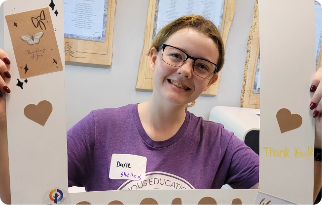 Student holding up Art